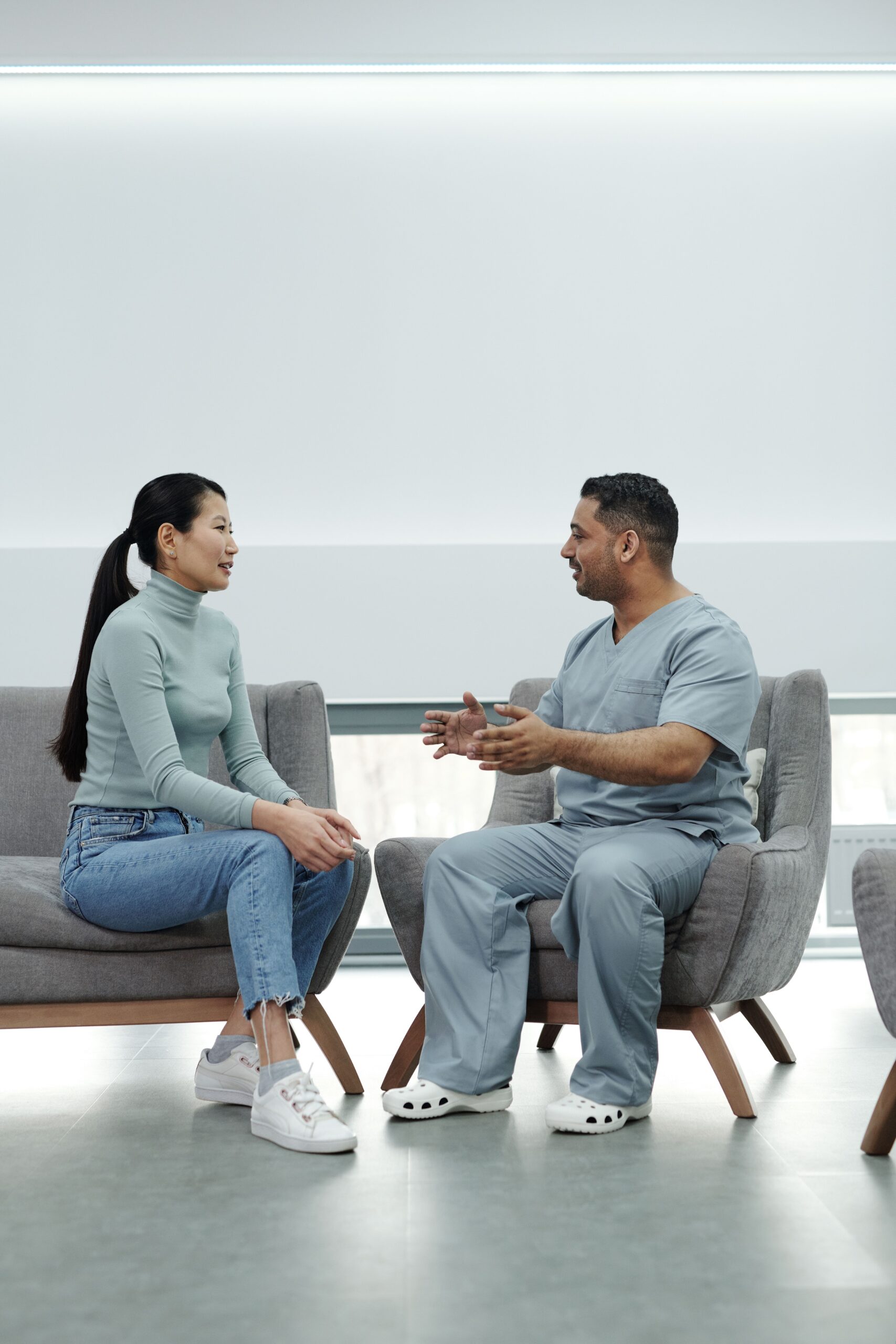 Doctor Talking to Asian Woman in hospital