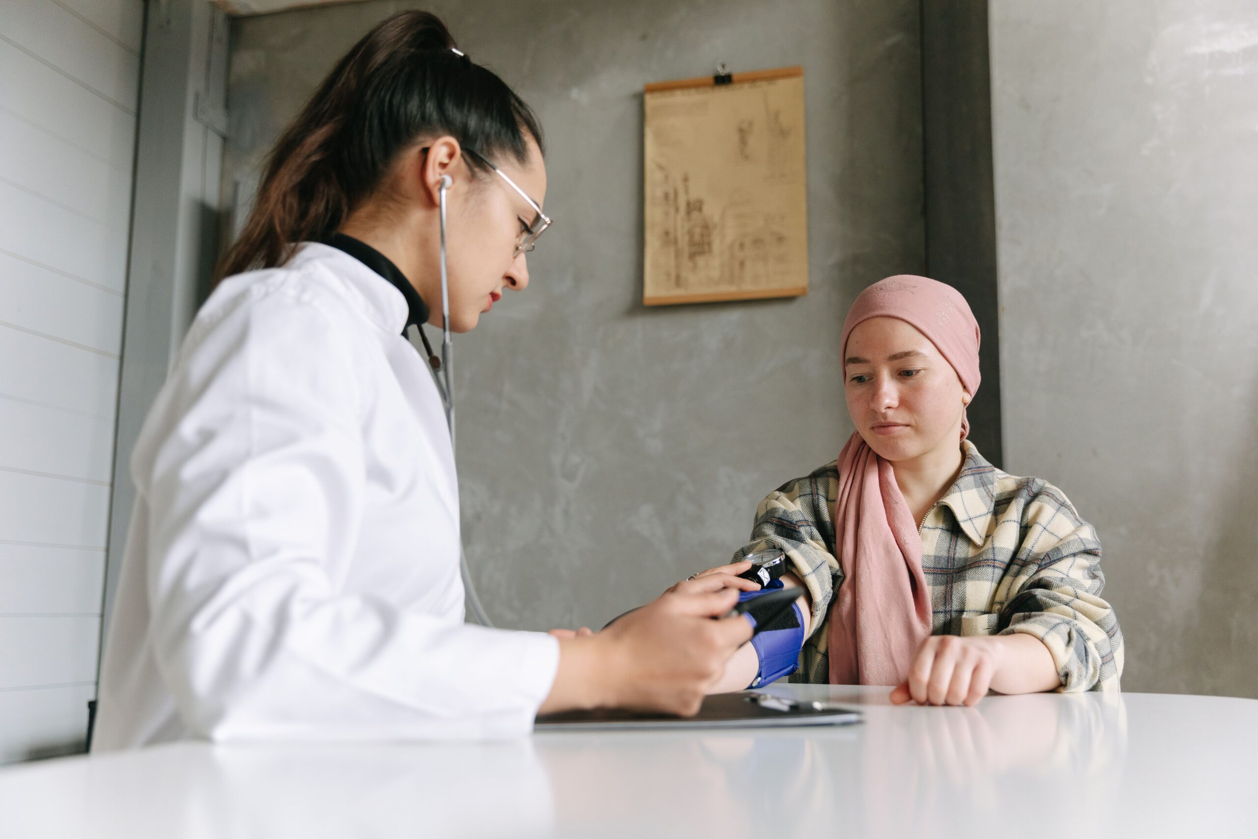 Dr Taking Blood Pressure Cancer Patient