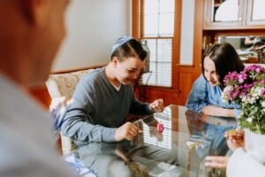 family playing dreidl